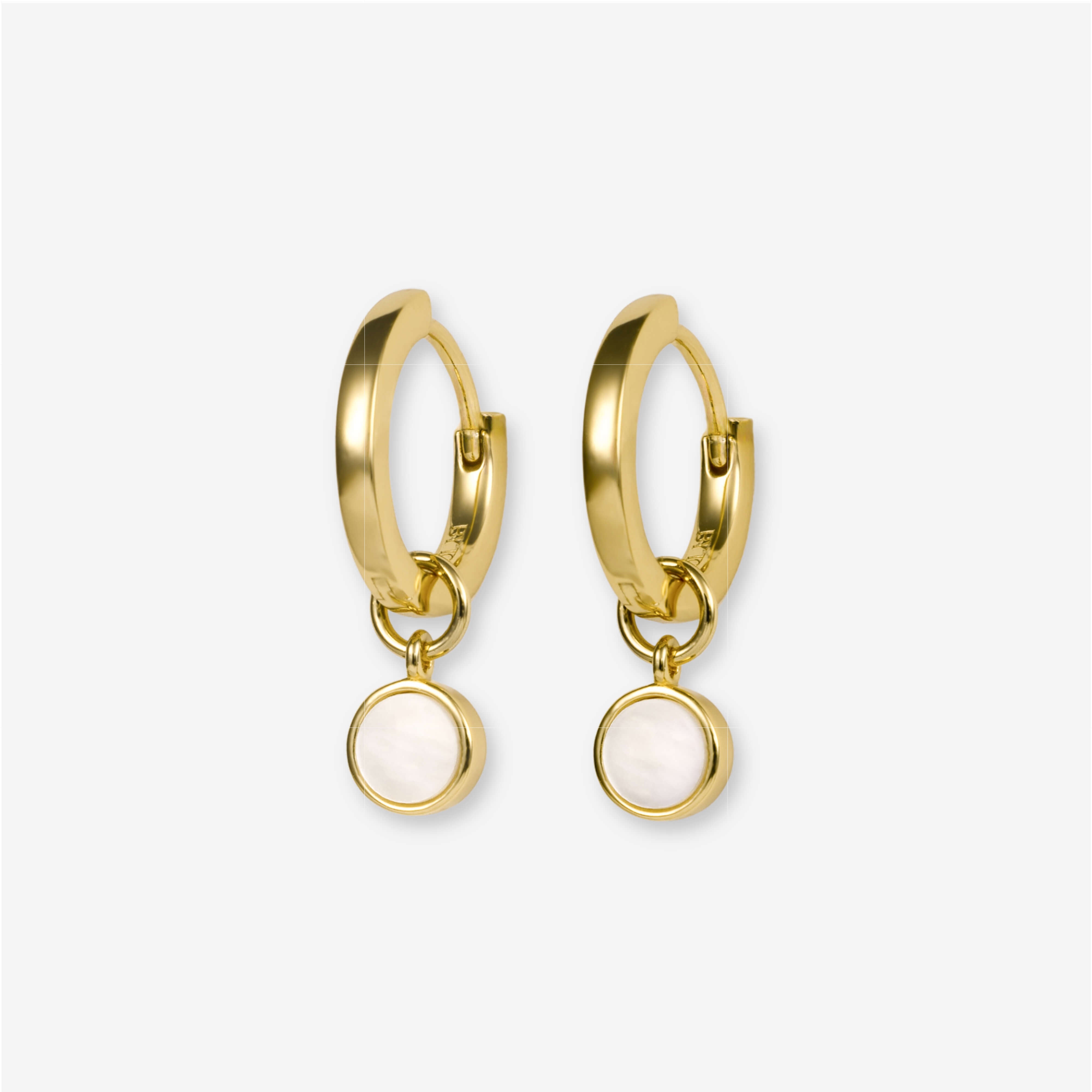 BY TONIN Heritage gold round hoop earrings with luminous circular mother of pearl charms.