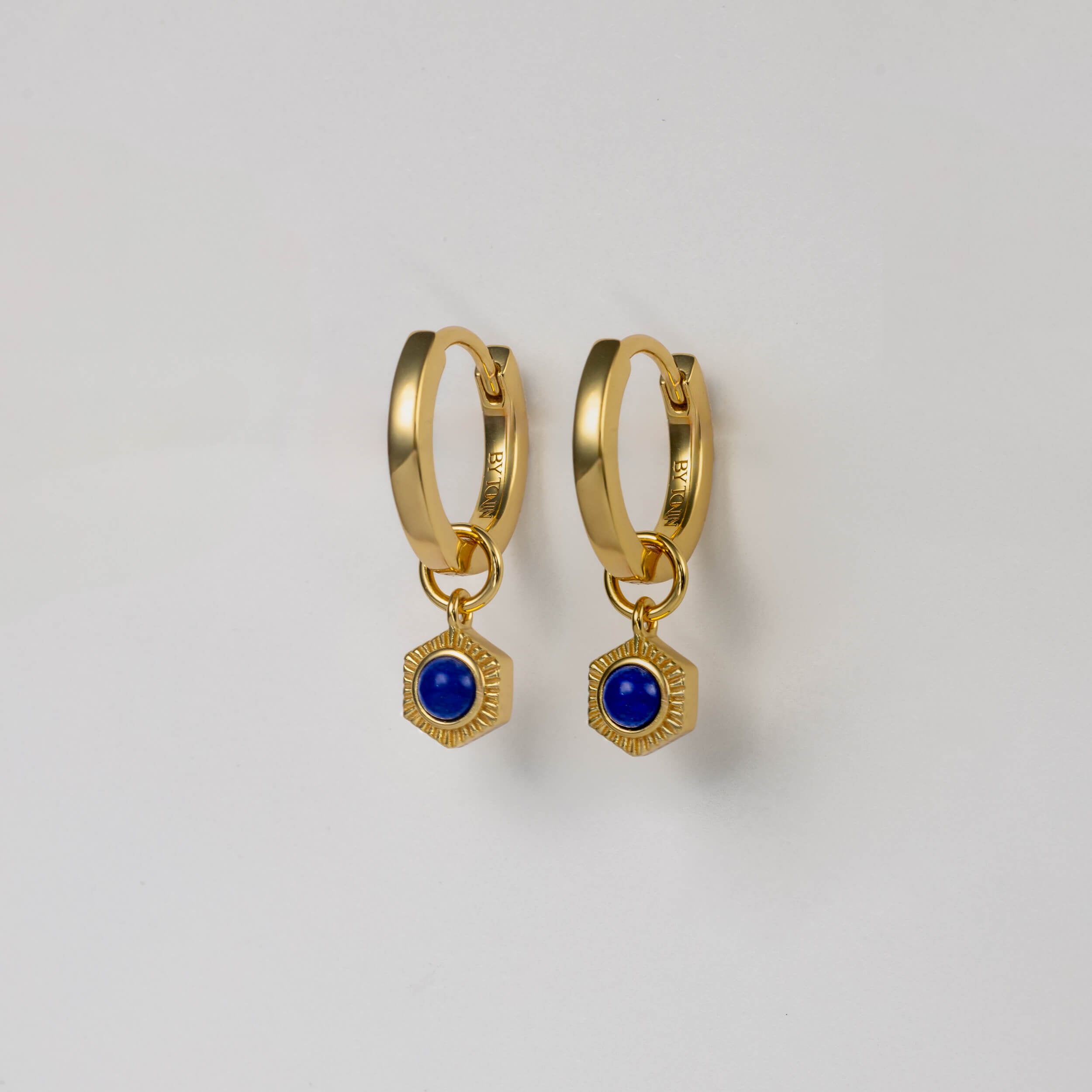 BY TONIN Bel e Viv gold hoop earrings with dazzling hexagonal blue lapis lazuli charms.
