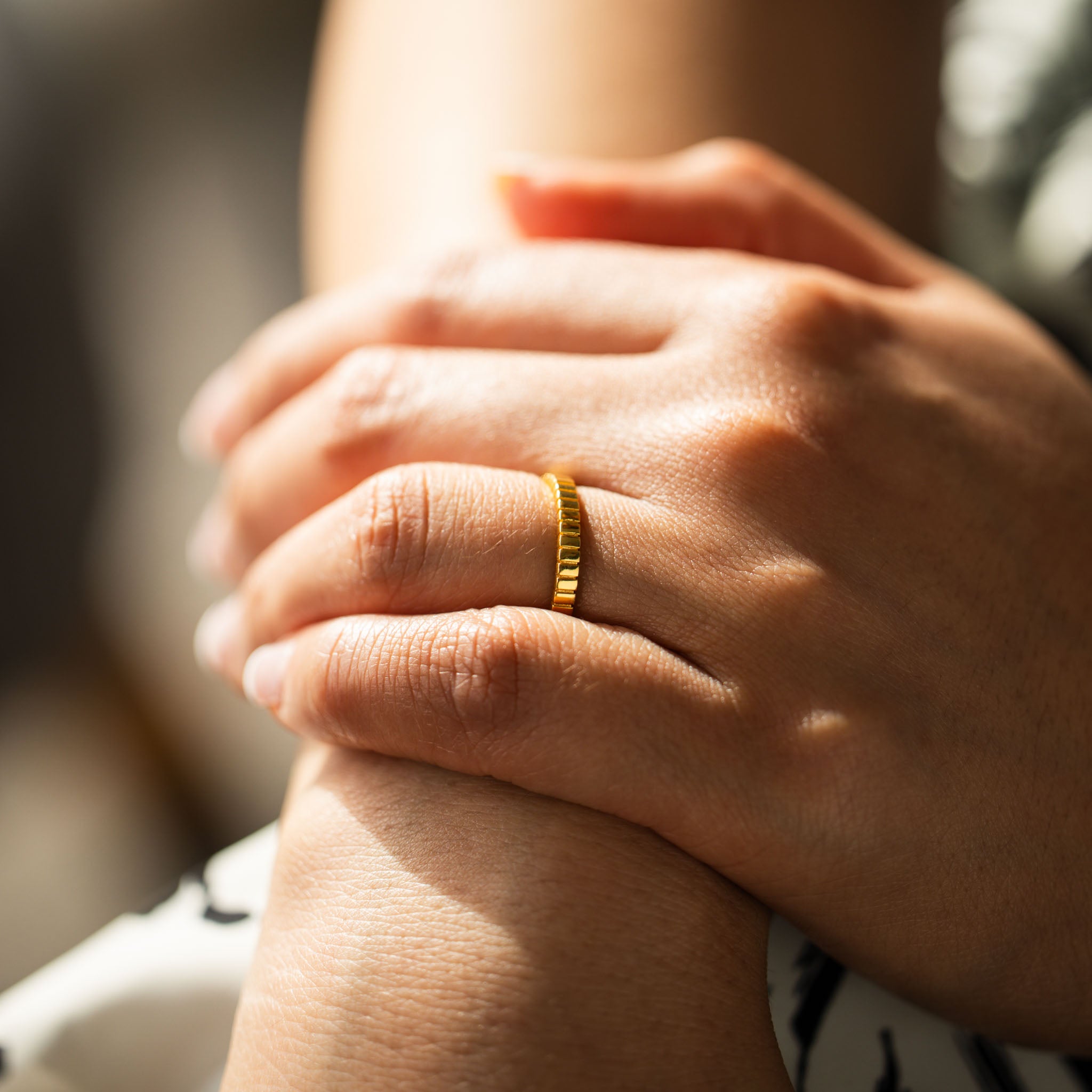 Adorn your hand with BY TONIN's Bel e Viv gold ridged ring, showcased in a stunning close-up to highlight its unique texture and elegant shine.