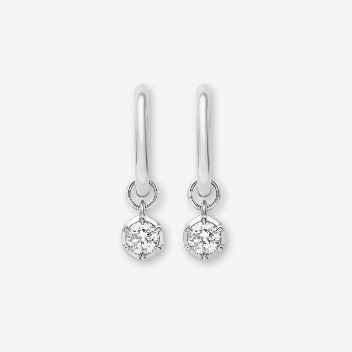Pair of 925 sterling silver small hoop earrings featuring delicate lab-grown diamond charms from the Essential Diamond Collection by BY TONIN, designed in NZ. A hypoallergenic, modern jewellery staple.