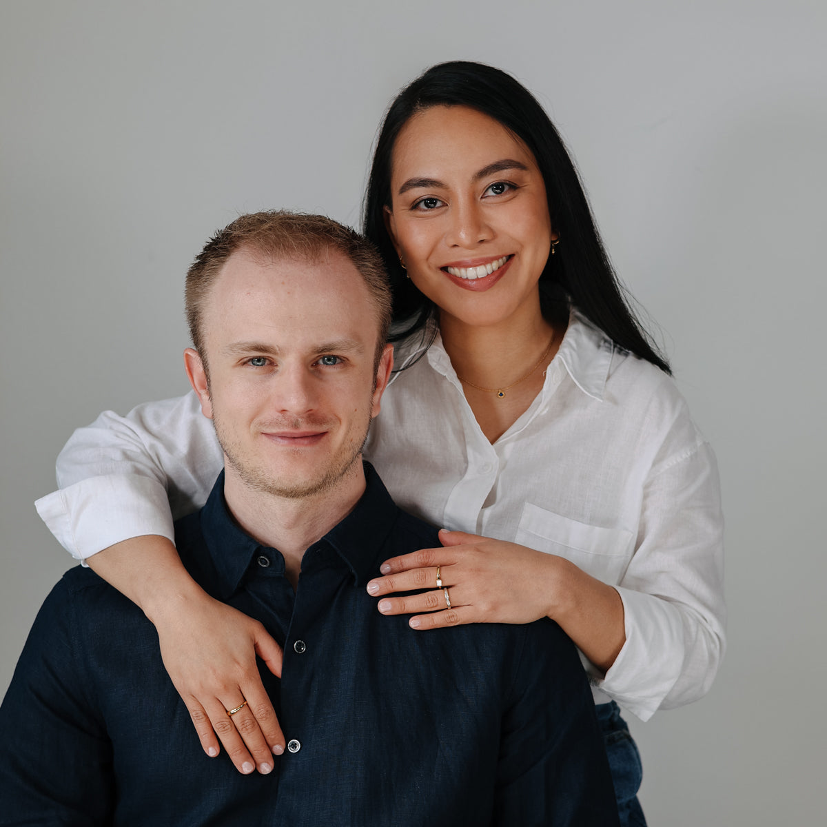 Meet Carlo and Mia Tonin, the visionary founders of BY TONIN, captured in a warm, inviting portrait embodying the brand's commitment to exquisite jewellery.