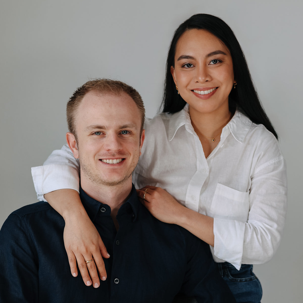 Meet Carlo and Mia Tonin, the passionate founders of BY TONIN, pictured in a warm, inviting portrait that embodies the brand's vision of exquisite jewellery.