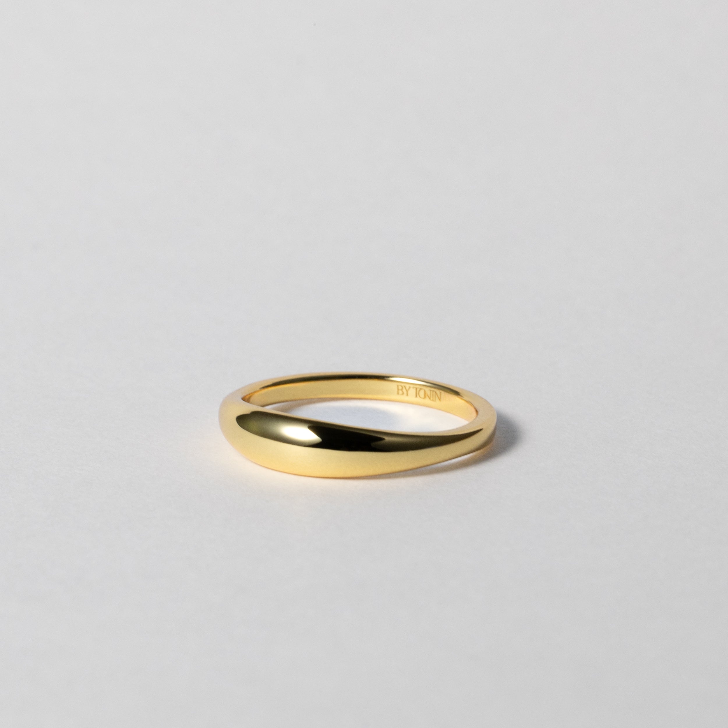BY TONIN's Heritage gold slim dome ring with a high-polished finish on white background.