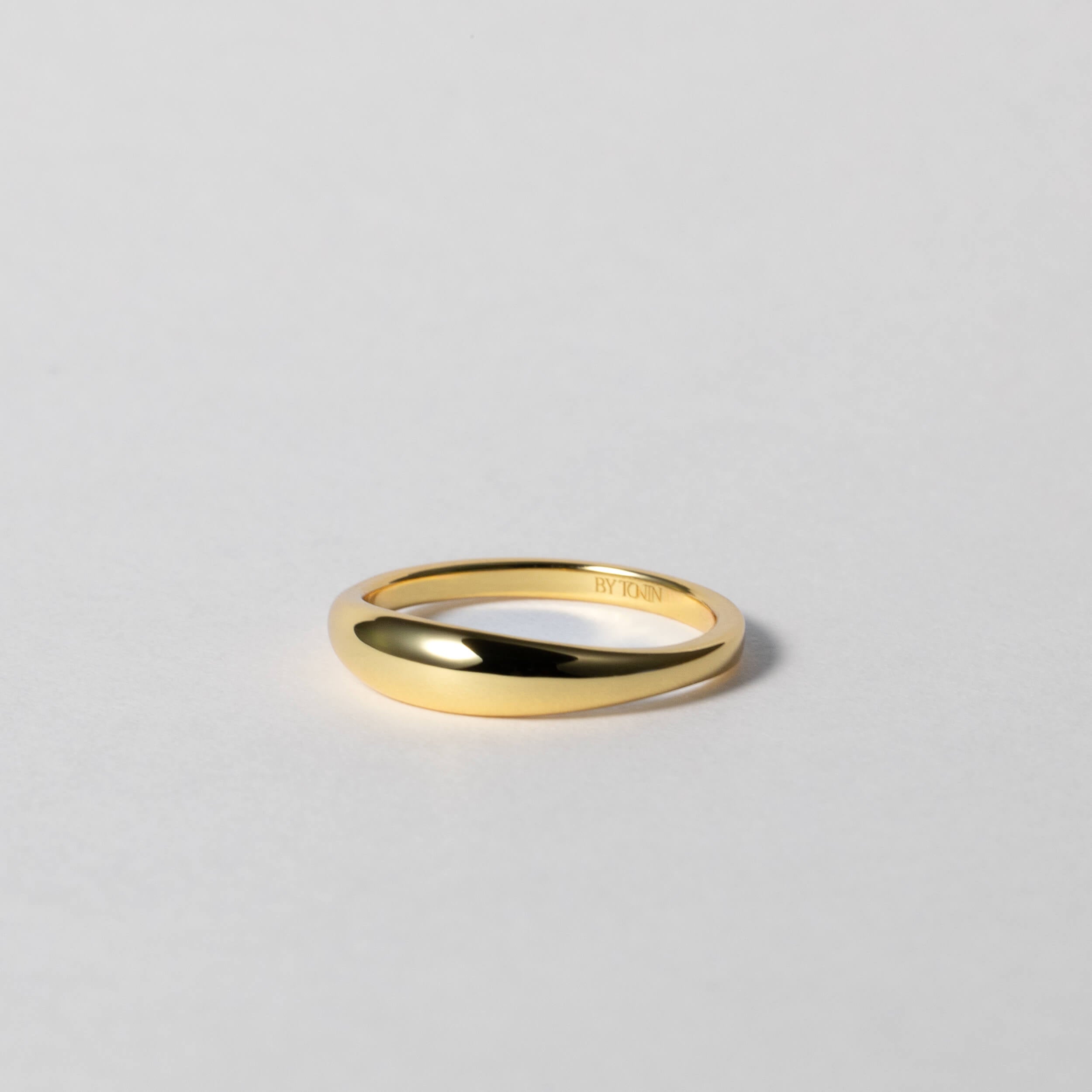 BY TONIN's Heritage gold slim dome ring with a high-polished finish on white background.