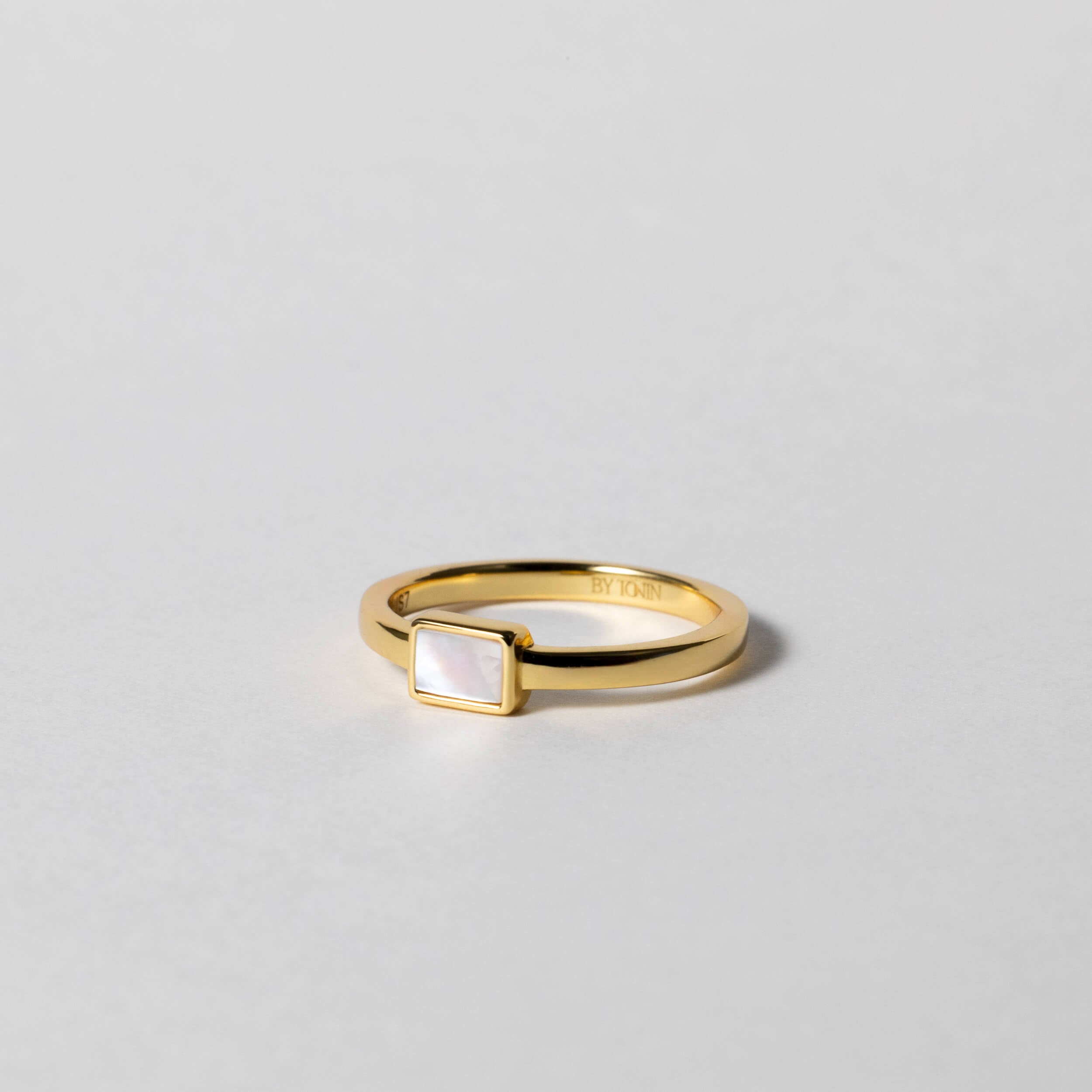 BY TONIN's Heritage gold ring featuring a rectangular mother of pearl centerpiece on white background.