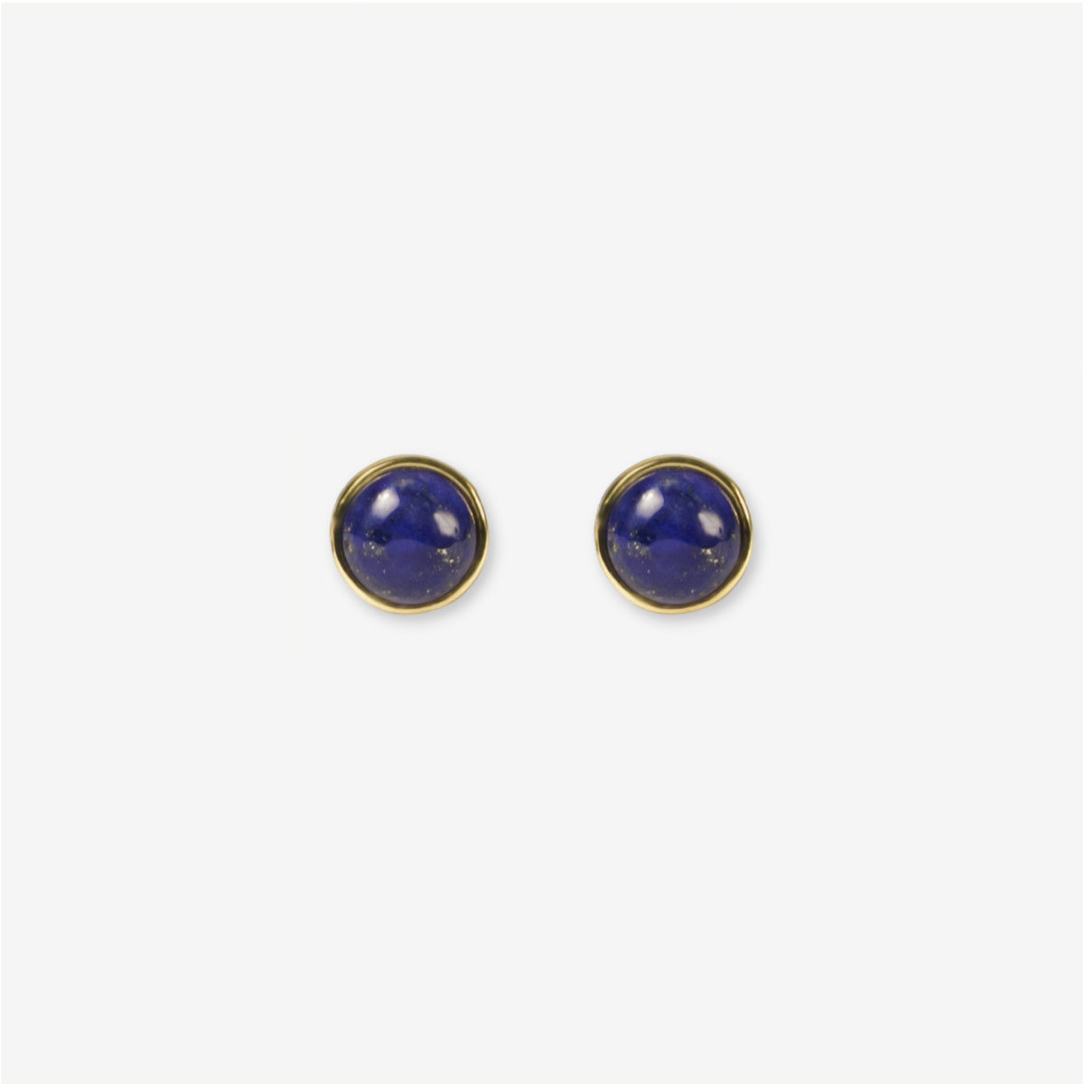 Illuminate your look with BY TONIN's Bel e Viv gold round stud earrings, showcasing captivating deep blue lapis lazuli on a crisp, light grey background for timeless appeal.