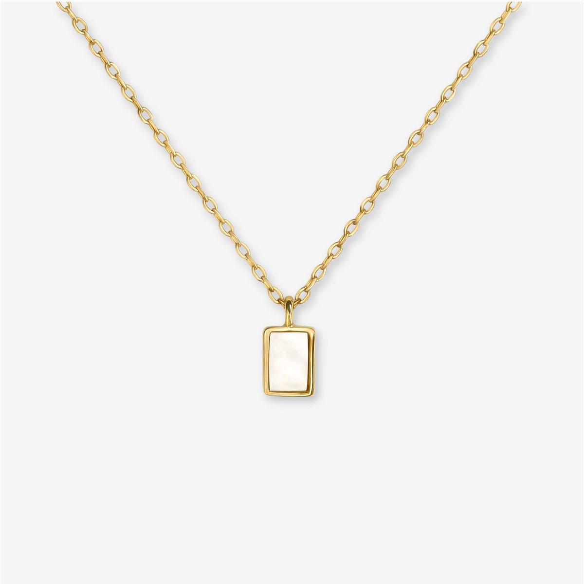 BY TONIN Heritage gold necklace with a rectangular mother of pearl pendant, showcasing its elegant design.