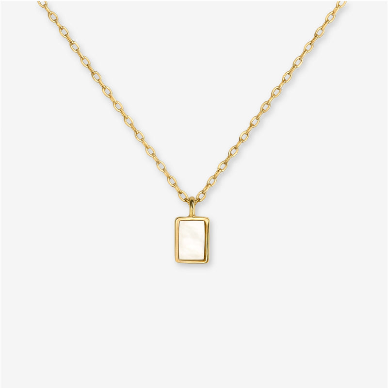 BY TONIN Heritage gold necklace with a rectangular mother of pearl pendant, showcasing its elegant design.