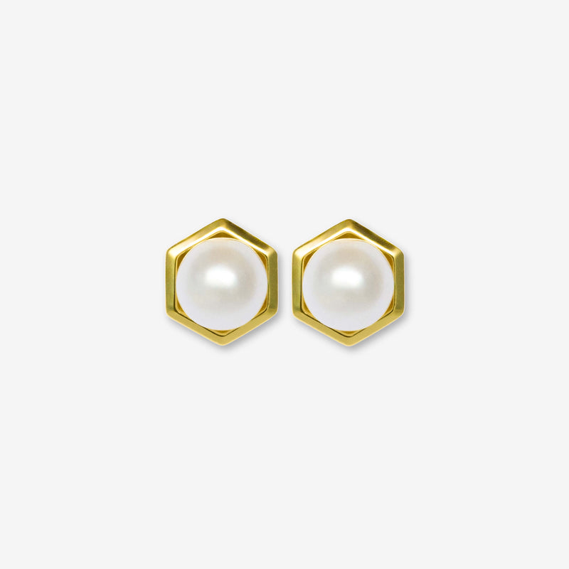 Hexagonal gold earrings with pearl centers on a white background