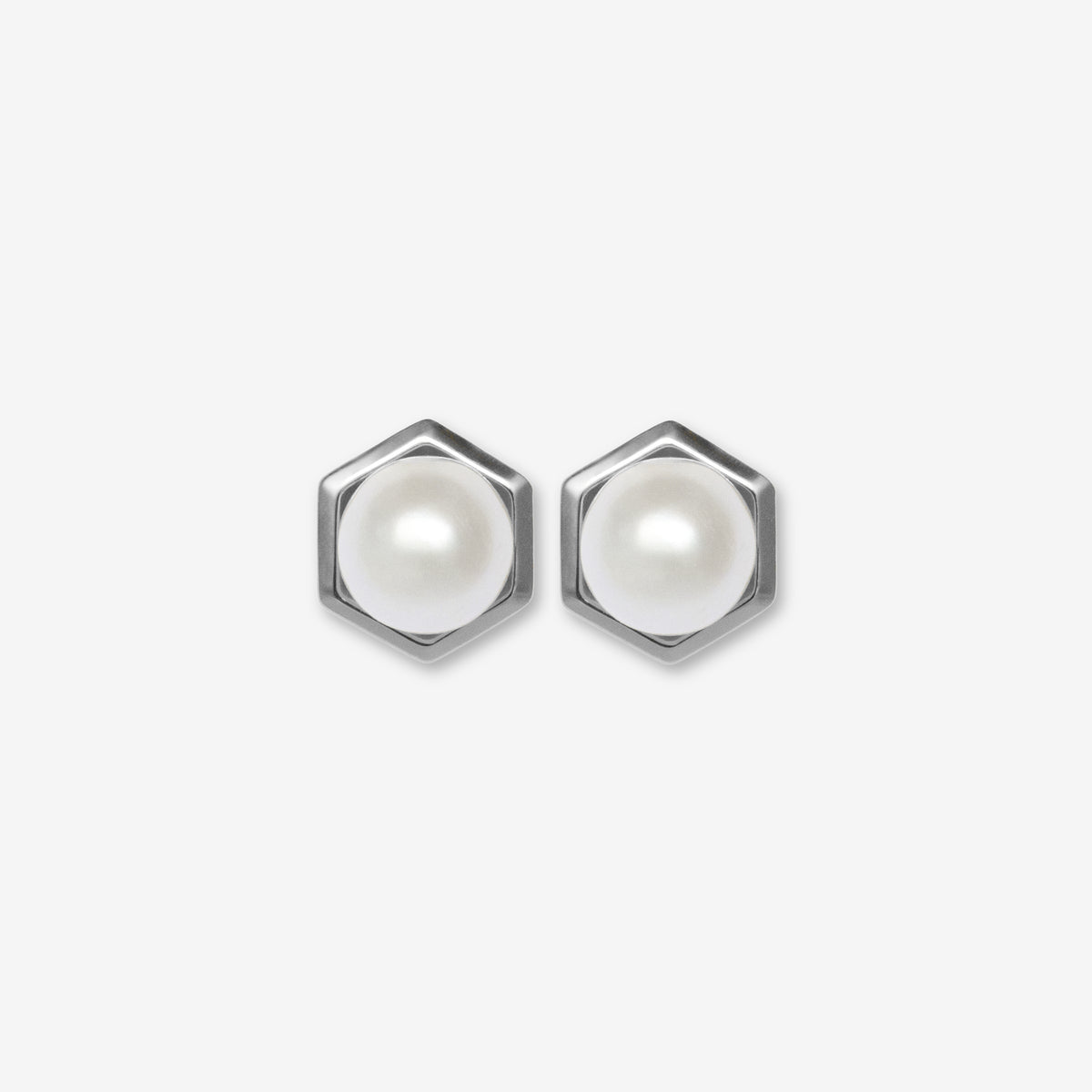 Hexagonal earrings with pearl centers on a white background