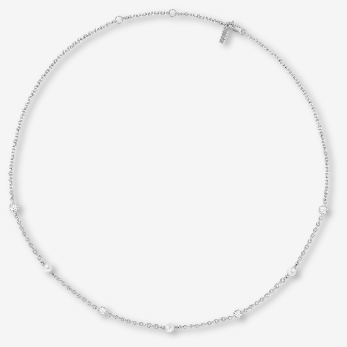 Silver necklace with pearls and topaz on a white background