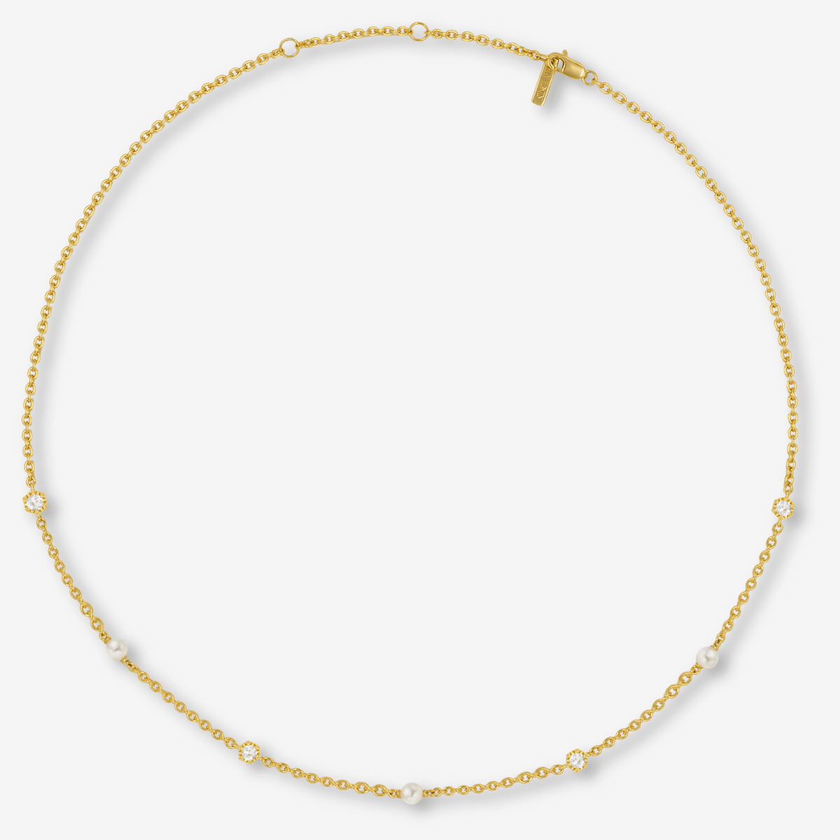 Gold chain necklace with pearls and topaz on a white background