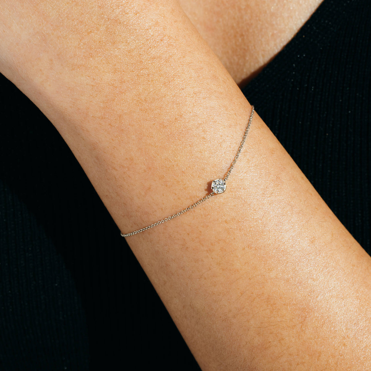 Close-up view of the BY TONIN Essential Diamonds Bracelet on a wrist, featuring a 0.2 ct lab-grown diamond set on a polished 925 sterling silver chain. Hypoallergenic and designed for everyday wear in NZ.