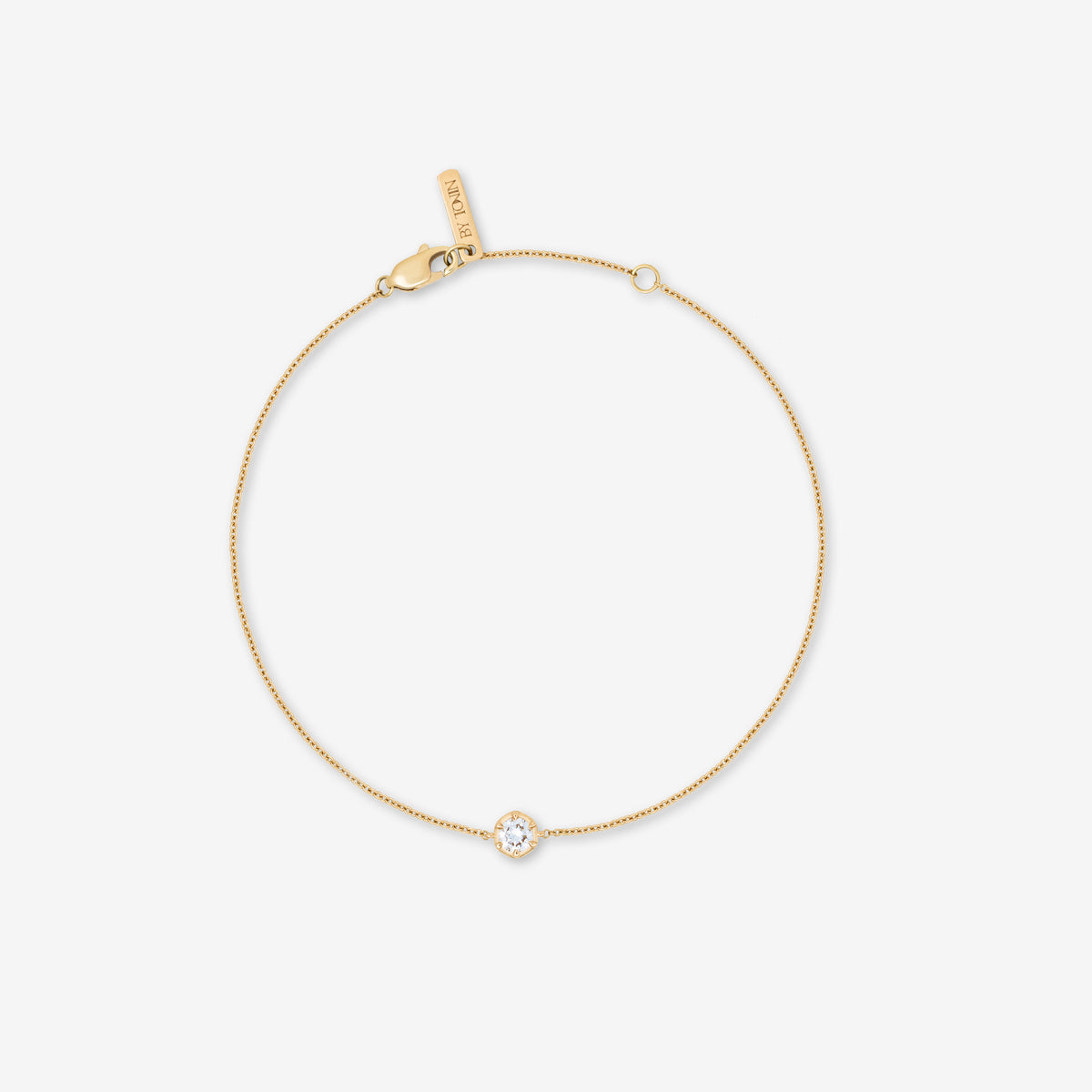 tudio product shot from the Essential Diamond Collection by BY TONIN, designed in NZ. Features the 9K gold delicate chain bracelet with a single bezel-set lab-grown diamond.