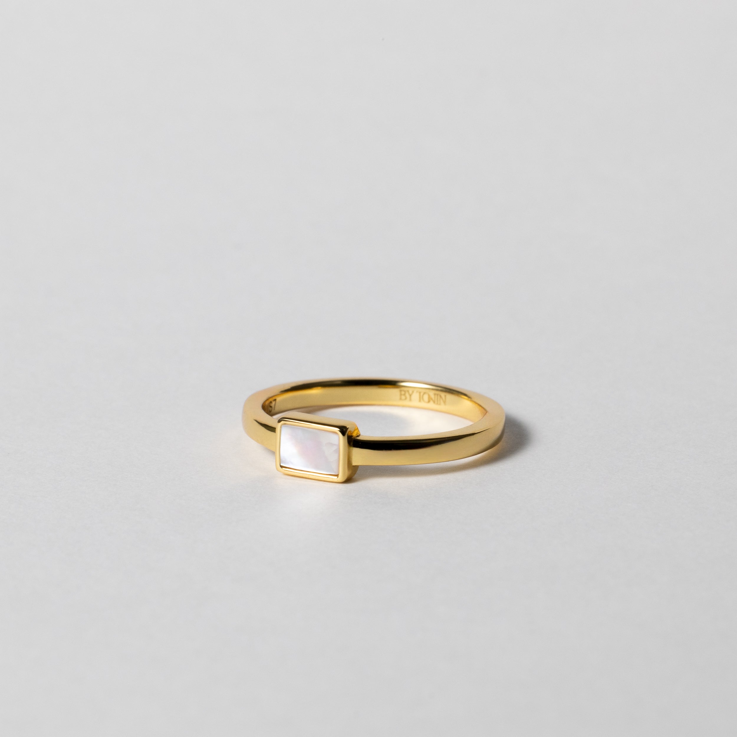 BY TONIN's Heritage gold ring featuring a rectangular mother of pearl centerpiece on white background.