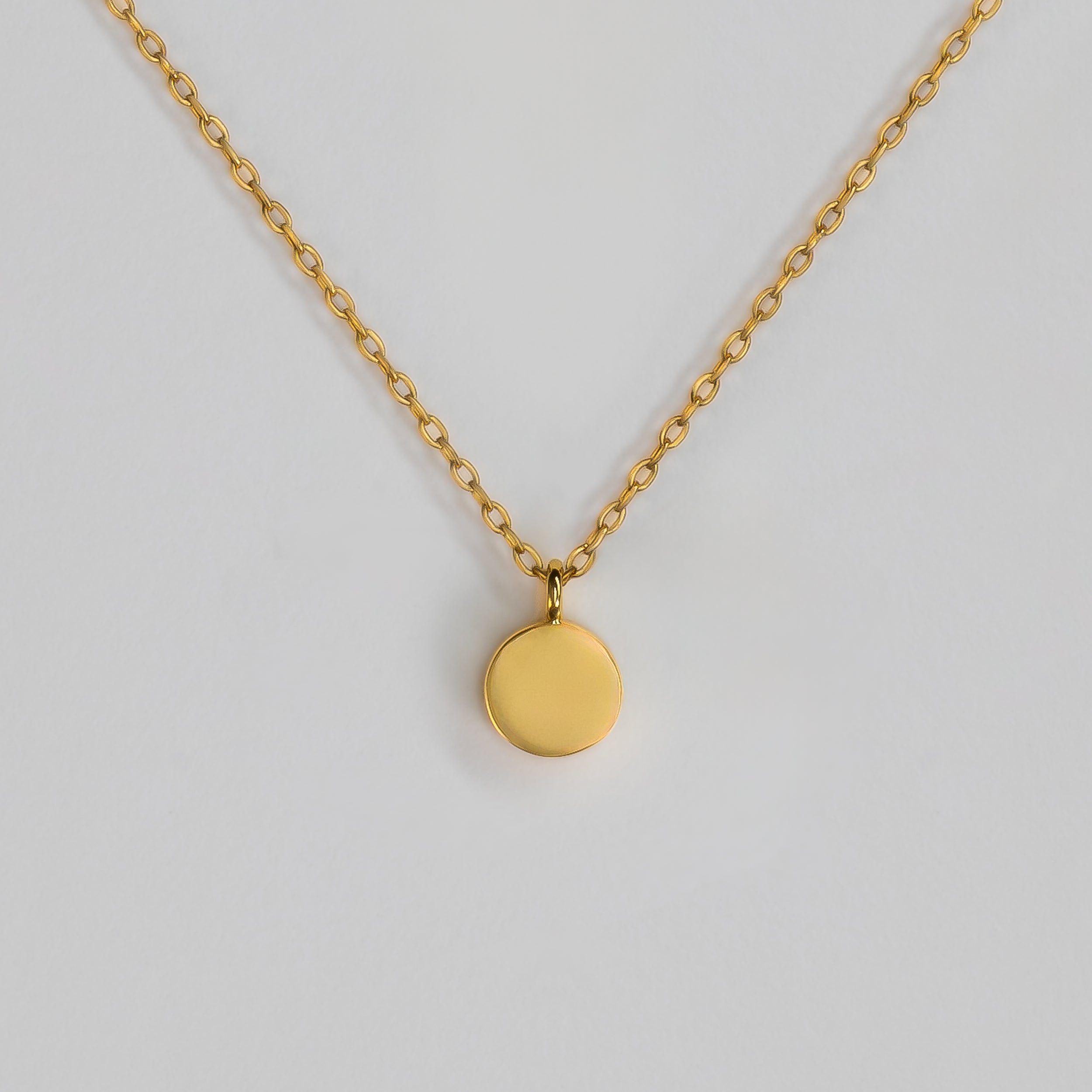 BY TONIN Heritage gold chain necklace with a polished round disc pendant, elegant and minimalist.