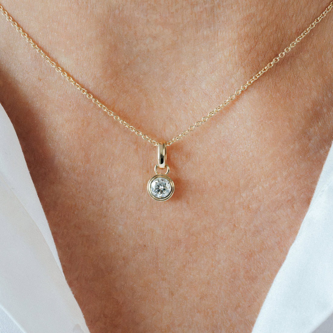 Necklace Collarbone Close-Up View
Diamond necklace in solid gold: BY TONIN 0.5ct solitaire lab grown diamond pendant necklace on model, buy fine jewellery NZ.